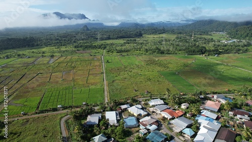 Obraz na płótnie Kuching, Malaysia - July 4 2024: Aerial View of The Skuduk Paddy Field w salonie