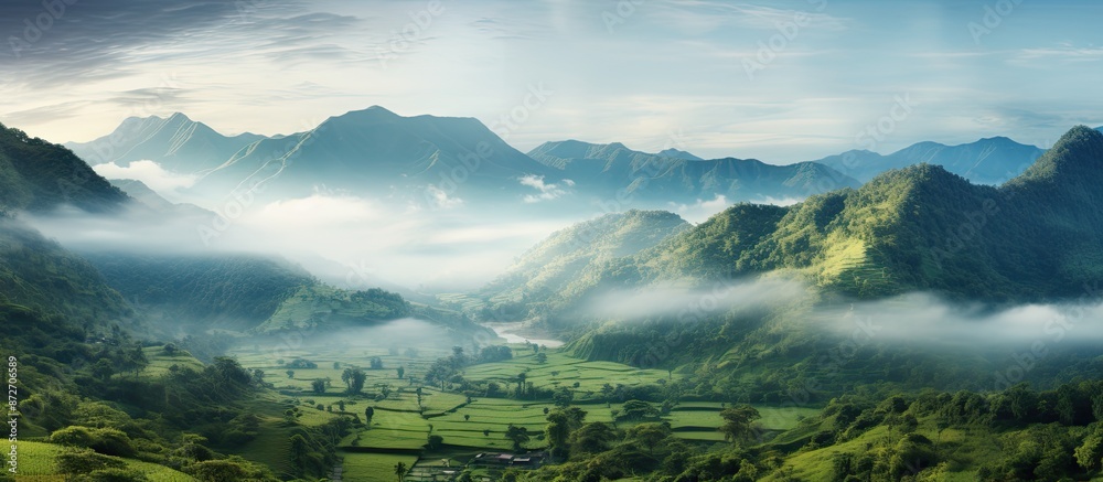 Mountain landscape filled with mist in the morning offers a warm ...