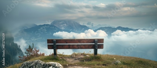 Bench on mountain peak over...