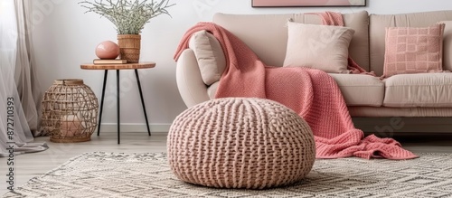 Pink blanket on beige sofa ...