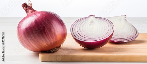 Onion being sliced on a whi...