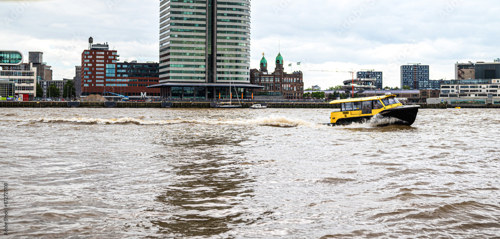 Water taxi in Rotterdam city centre. Water taxi in Rotterdam city centre.