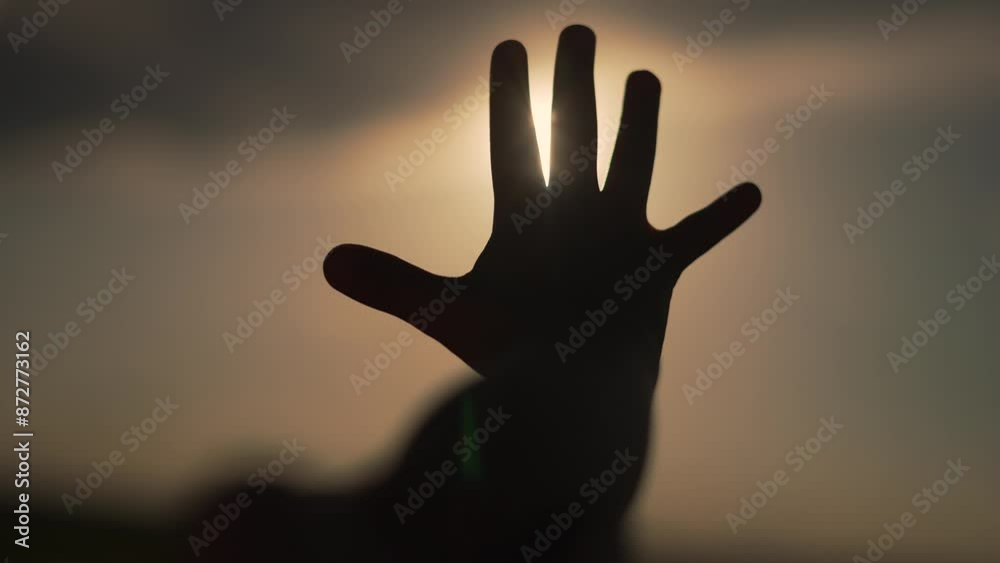 Happy hand reaching skyward. Silhouette of hand in sky. Joyful moment with sunrise sky. Sunrise illuminates hand in sky. Happy sunrise scene with sky silhouette. Hand embracing sunrise happiness. Happy hand reaching skyward. Silhouette of hand in sky. Joyful moment with sunrise sky. Sunrise illuminates hand in sky. Happy sunrise scene with sky silhouette. Hand embracing sunrise happiness.