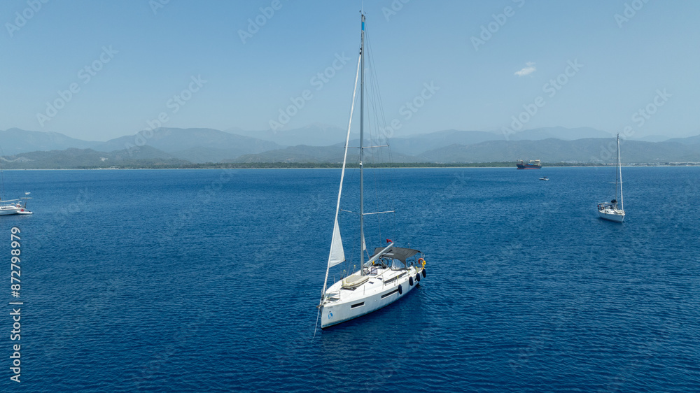 Aerial view of a sail boat on the shallow water. Aerial view of a sail boat on the shallow water.