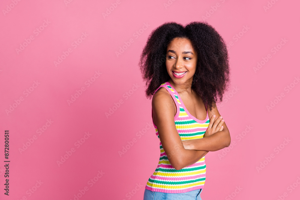 Naklejka premium Photo of adorable woman with perming coiffure dressed knit tank arms crossed look at sale empty space isolated on pink color background