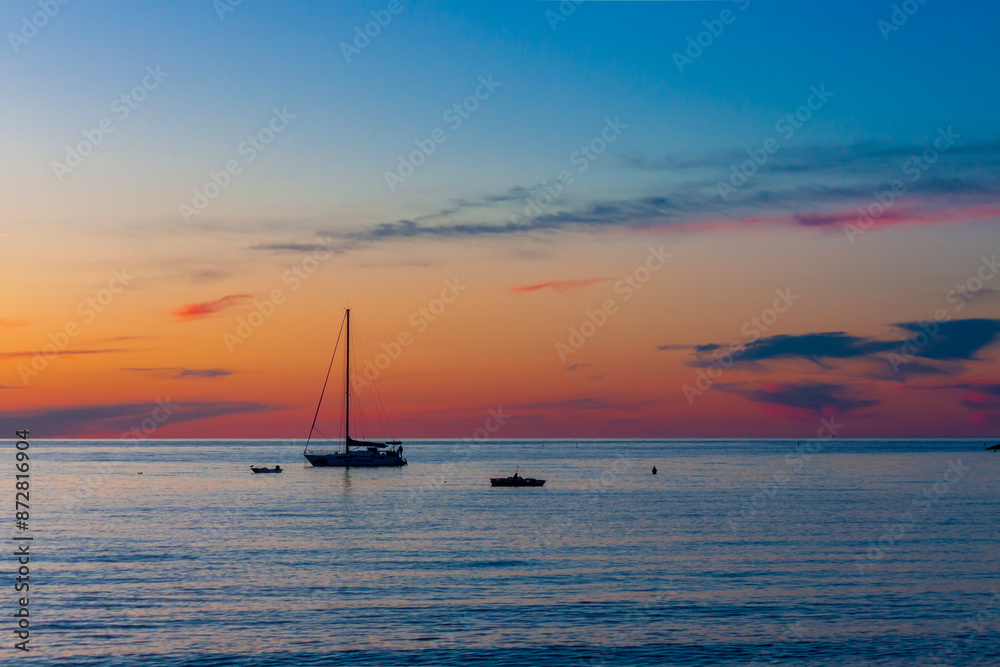 Panorama of sea sunset. Evening sky with clouds over the sea. Dramatic coloured sunset over the sea. Panorama of sea sunset. Evening sky with clouds over the sea. Dramatic coloured sunset over the sea.