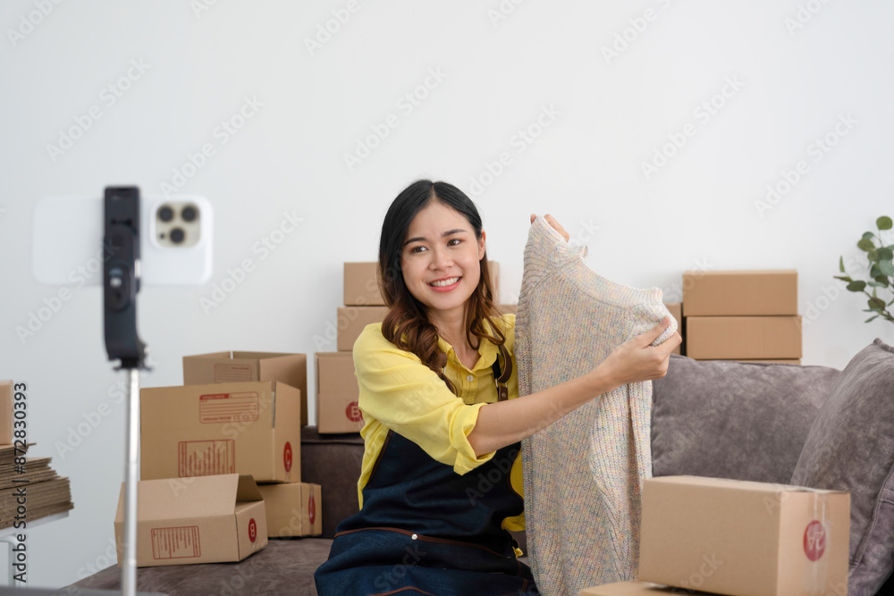 Young woman showcasing product for online sale. Young woman showcasing product for online sale.