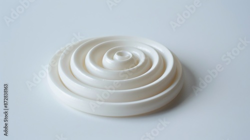 Isolated white citronella spiral coil made from pure ingredients and natural glue with lasting scent For meditation and worship with copy space photo