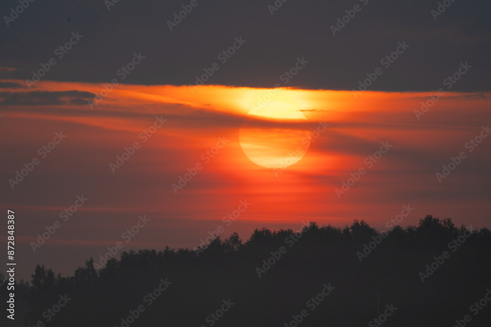 Fototapeta premium summer evening, sunset in yellow, orange and pink with clouds, background
