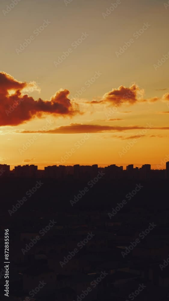 Urban sunset, orange sunset, urban sunset timelapse, the sun sets behind the houses, vertical sunset shooting Urban sunset, orange sunset, urban sunset timelapse, the sun sets behind the houses, vertical sunset shooting