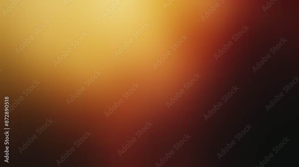 Naklejka premium Abstract blurred gradient background in warm hues of yellow, orange, and red, creating a soft and cozy atmosphere for designs or presentations.