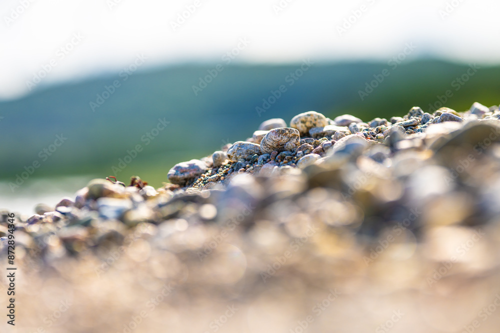 Round brounded rocks on a beach.