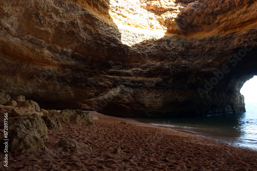 Praia de Benagil is located on one of the most beautiful stretches of the Algarve coast, where the jagged cliffs form caves and sinkholes. Algarve, Portugal.