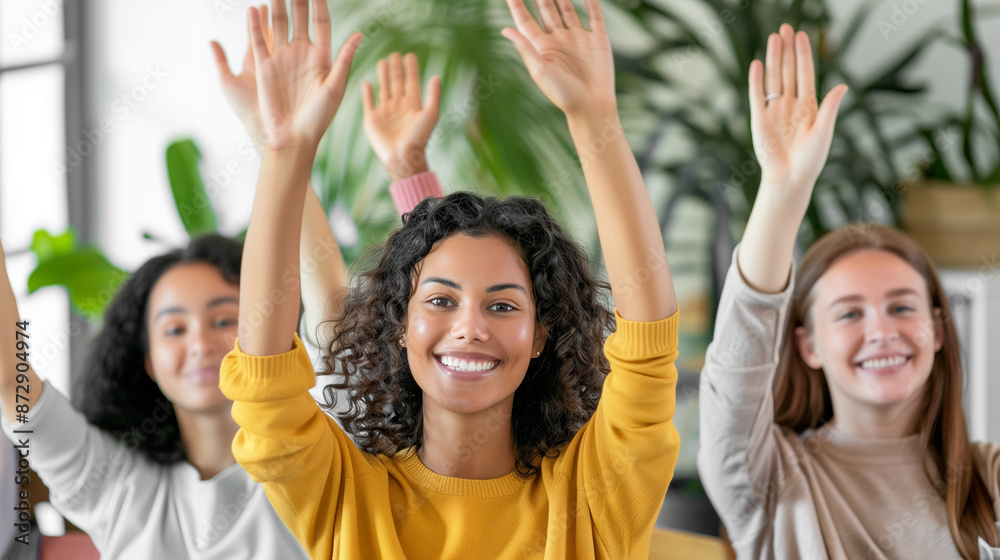 Fototapeta premium Diverse Students Raising Hands in Classroom