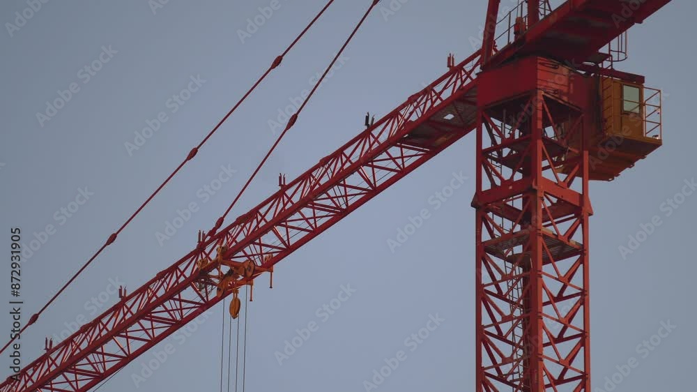 Building a house, people are building a house, the work of a tower crane Building a house, people are building a house, the work of a tower crane
