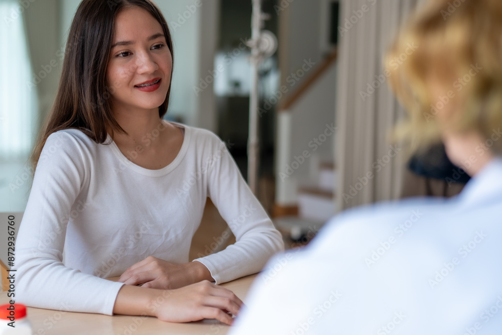 Teen Girl Giving Interview to Social Worker or Psychologist for Counseling and Therapy Session on Depression Teen Girl Giving Interview to Social Worker or Psychologist for Counseling and Therapy Session on Depression