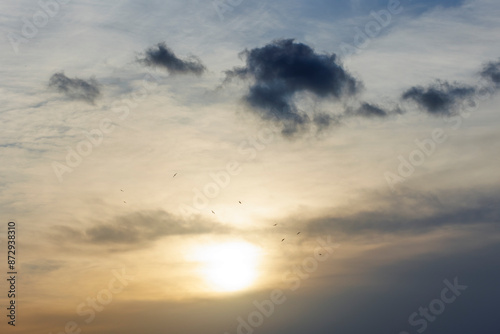 Sun is setting behind the clouds and cloudy background for the purpose of the web and design uses