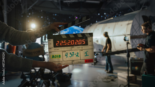 Quadro su tela Director Filming Ad Shoot With Astronaut Fixing Satellite