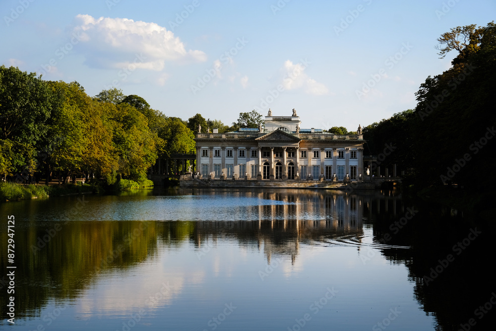 Sunset over the Palace Łazienki or Palace of the Water (Palace on the Isle) at Lazienki park in Warsaw, Poland Sunset over the Palace Łazienki or Palace of the Water (Palace on the Isle) at Lazienki park in Warsaw, Poland