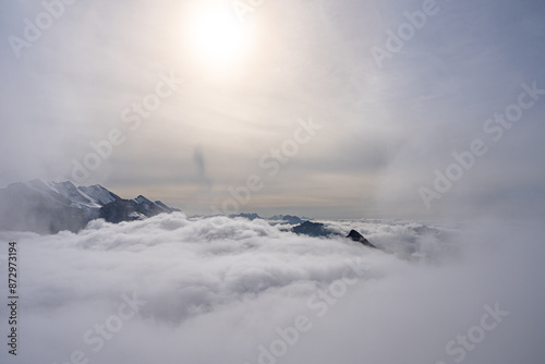 Obraz na płótnie View of Swiss Alps over clouds on a bright sunny day from Schilthorn summit in Switzerland w salonie