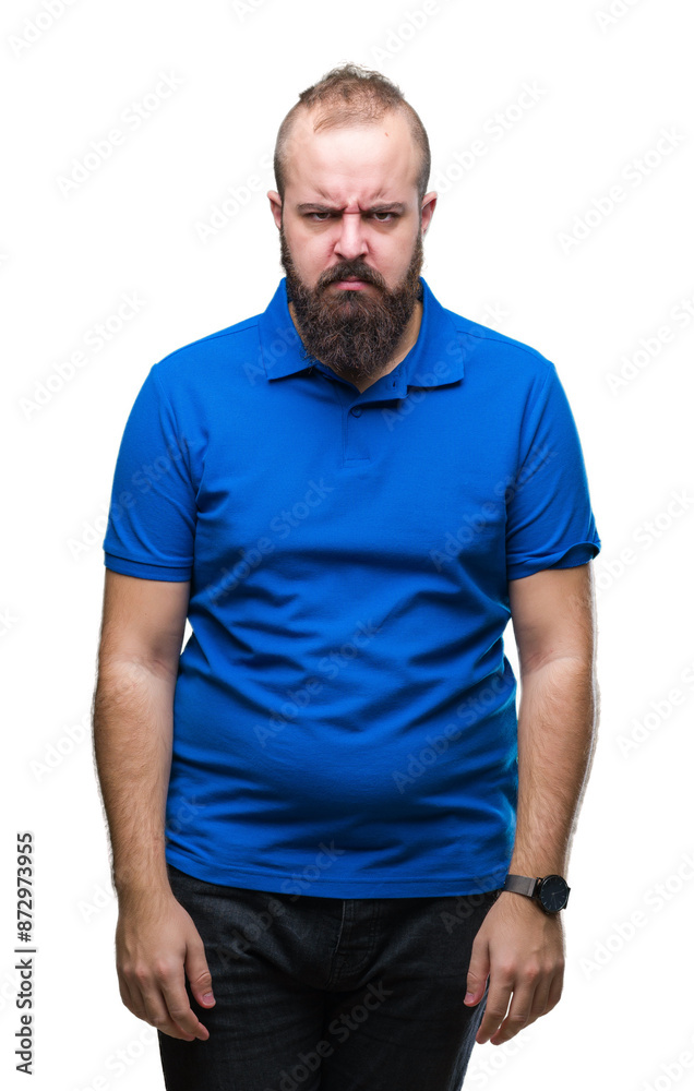 Young caucasian hipster man wearing blue shirt over isolated background skeptic and nervous, frowning upset because of problem. Negative person. Young caucasian hipster man wearing blue shirt over isolated background skeptic and nervous, frowning upset because of problem. Negative person.