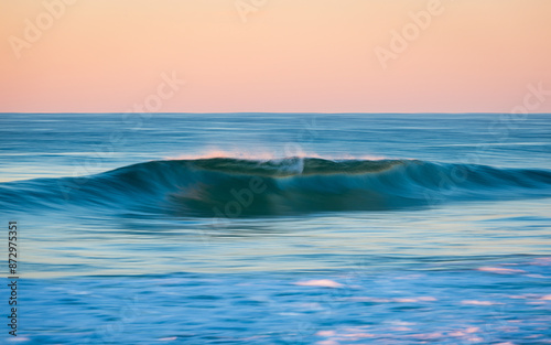 Clean and smooth wave in motion at the beach.