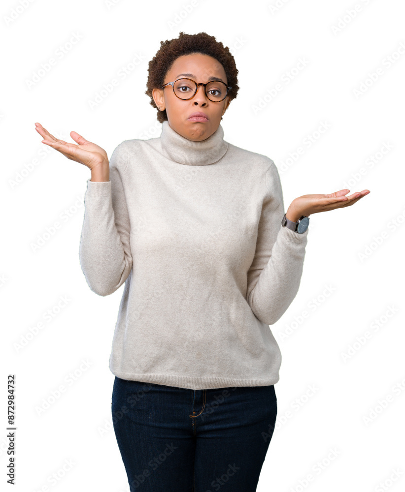 Young beautiful african american woman wearing glasses over isolated background clueless and confused expression with arms and hands raised. Doubt concept.