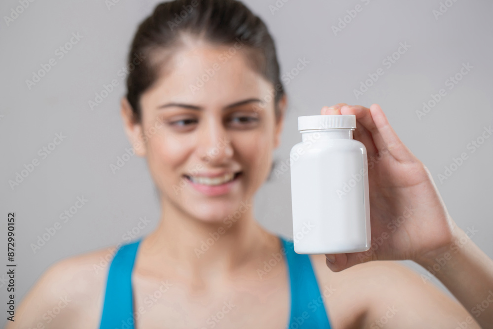 Beautiful Gorgeous Woman Showing Bottle Of Tablet Beautiful Gorgeous Woman Showing Bottle Of Tablet