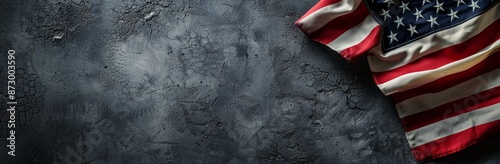 American Flag Draped Over Grey Concrete Background