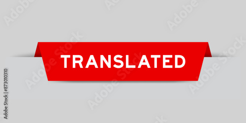 Red color inserted label with word translated on gray background