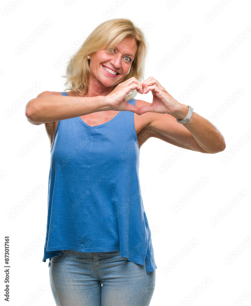 Middle age blonde woman over isolated background smiling in love showing heart symbol and shape with hands. Romantic concept. Middle age blonde woman over isolated background smiling in love showing heart symbol and shape with hands. Romantic concept.