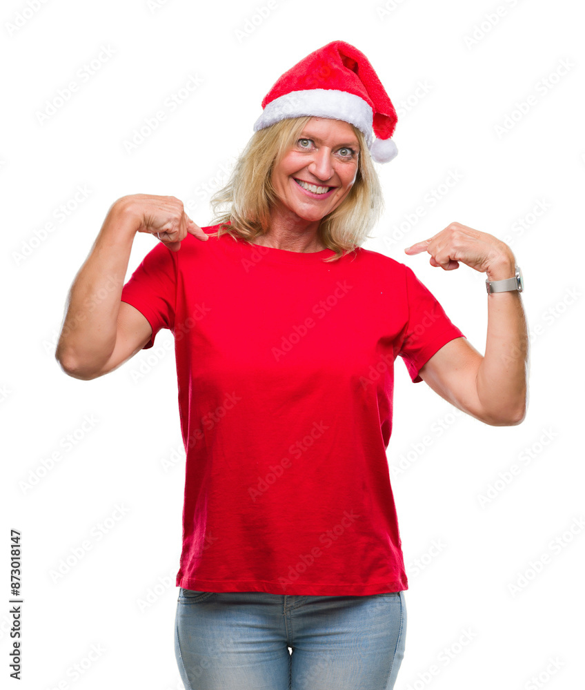 Middle age blonde woman wearing christmas hat over isolated background looking confident with smile on face, pointing oneself with fingers proud and happy. Middle age blonde woman wearing christmas hat over isolated background looking confident with smile on face, pointing oneself with fingers proud and happy.
