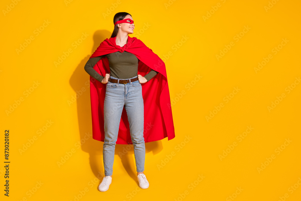 Full body photo of attractive teen woman look empty space superman dressed stylish khaki clothes isolated on yellow color background