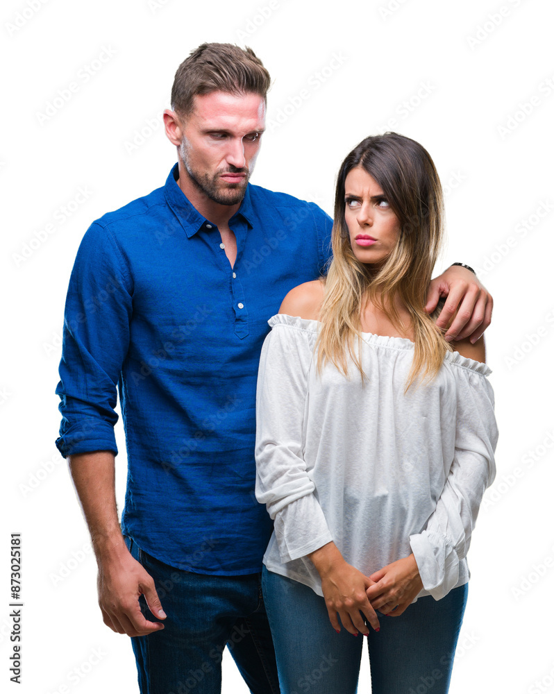 Young couple in love over isolated background skeptic and nervous, frowning upset because of problem. Negative person. Young couple in love over isolated background skeptic and nervous, frowning upset because of problem. Negative person.