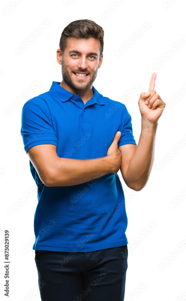 Young handsome man over isolated background with a big smile on face, pointing with hand and finger to the side looking at the camera. Young handsome man over isolated background with a big smile on face, pointing with hand and finger to the side looking at the camera.
