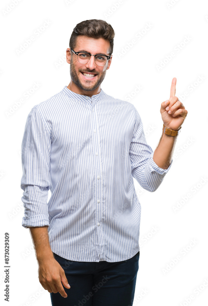 Young handsome man over isolated background with a big smile on face, pointing with hand and finger to the side looking at the camera. Young handsome man over isolated background with a big smile on face, pointing with hand and finger to the side looking at the camera.