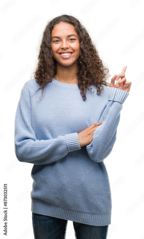 Beautiful young hispanic woman very happy pointing with hand and finger to the side Beautiful young hispanic woman very happy pointing with hand and finger to the side