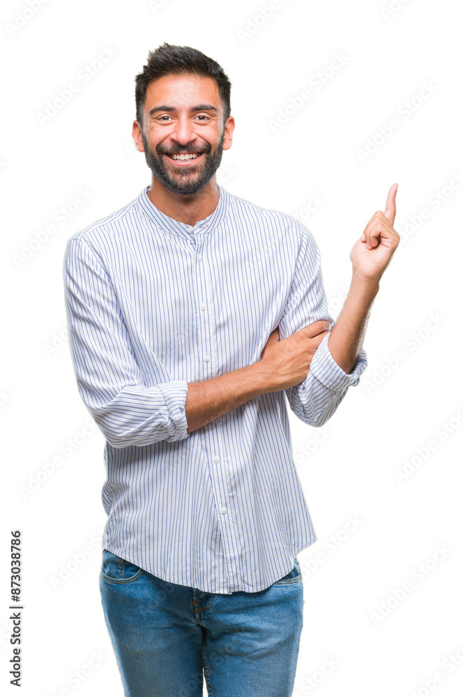 Adult hispanic man over isolated background with a big smile on face, pointing with hand and finger to the side looking at the camera. Adult hispanic man over isolated background with a big smile on face, pointing with hand and finger to the side looking at the camera.