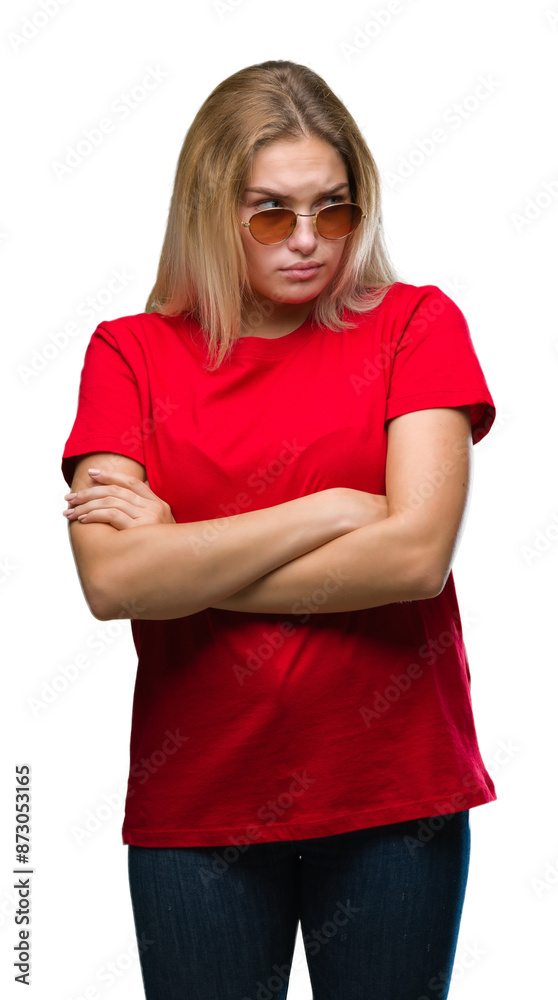 Young caucasian woman wearing sunglasses over isolated background skeptic and nervous, disapproving expression on face with crossed arms. Negative person. Young caucasian woman wearing sunglasses over isolated background skeptic and nervous, disapproving expression on face with crossed arms. Negative person.