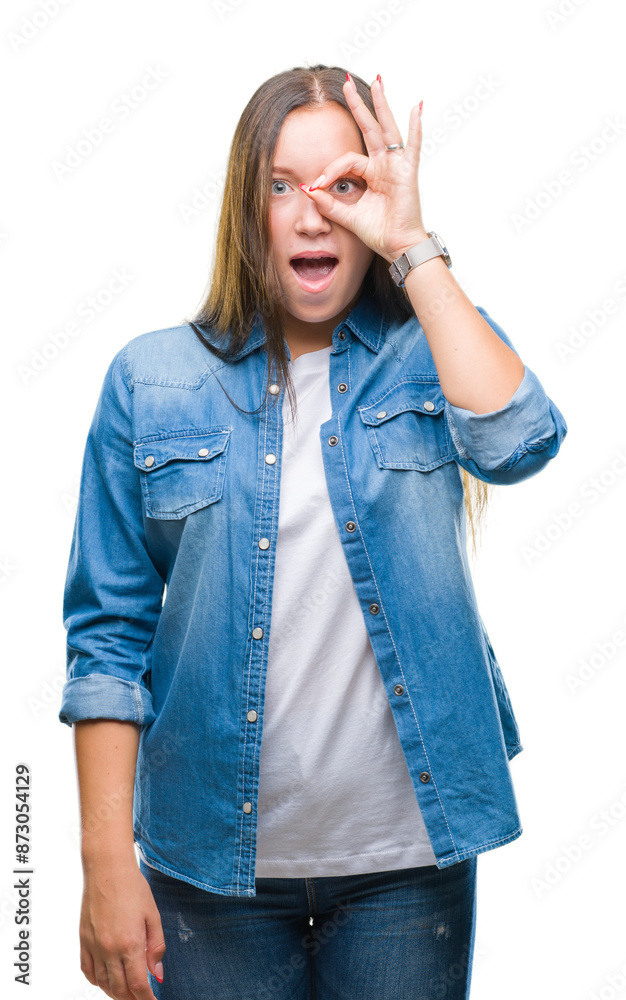Young caucasian beautiful woman over isolated background doing ok gesture shocked with surprised face, eye looking through fingers. Unbelieving expression. Young caucasian beautiful woman over isolated background doing ok gesture shocked with surprised face, eye looking through fingers. Unbelieving expression.