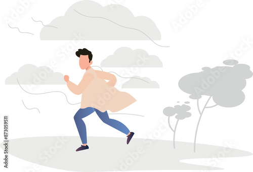 The boy is running in windy weather.