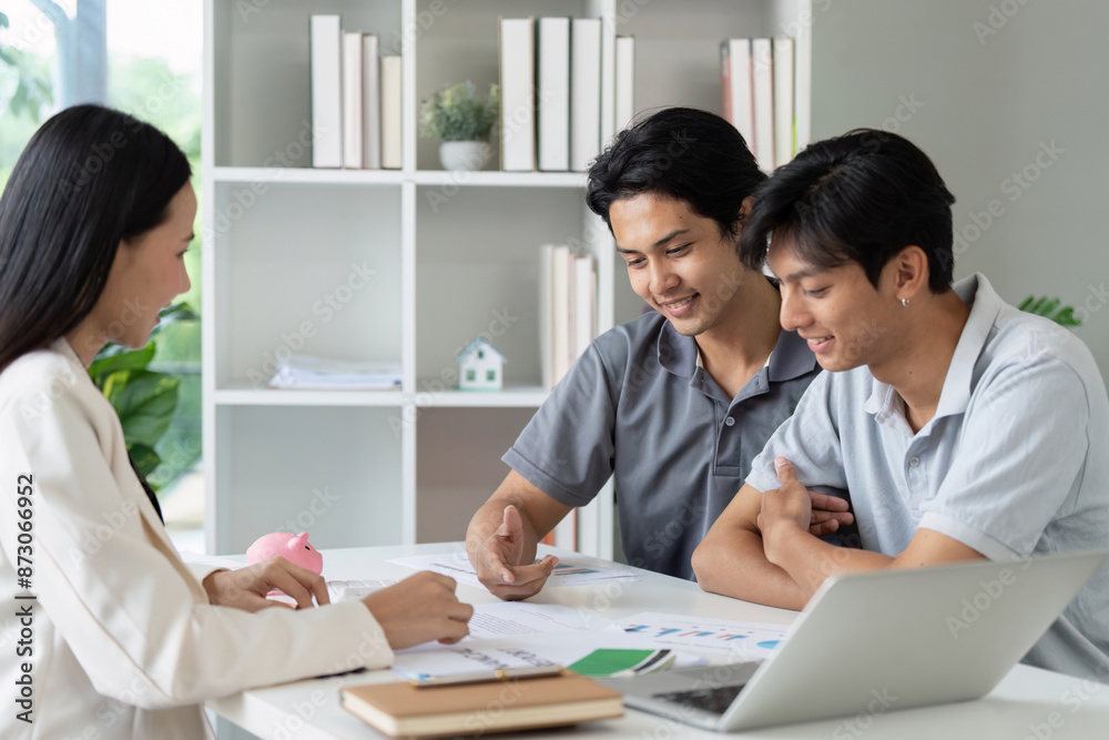 LGBTQIA gay couple consulting with financial advisor in modern office. Concept of financial planning and teamwork LGBTQIA gay couple consulting with financial advisor in modern office. Concept of financial planning and teamwork