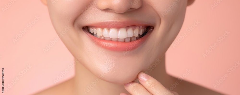 Obraz premium Closeup of a Woman Smiling with Perfectly White Teeth and Pink Lips