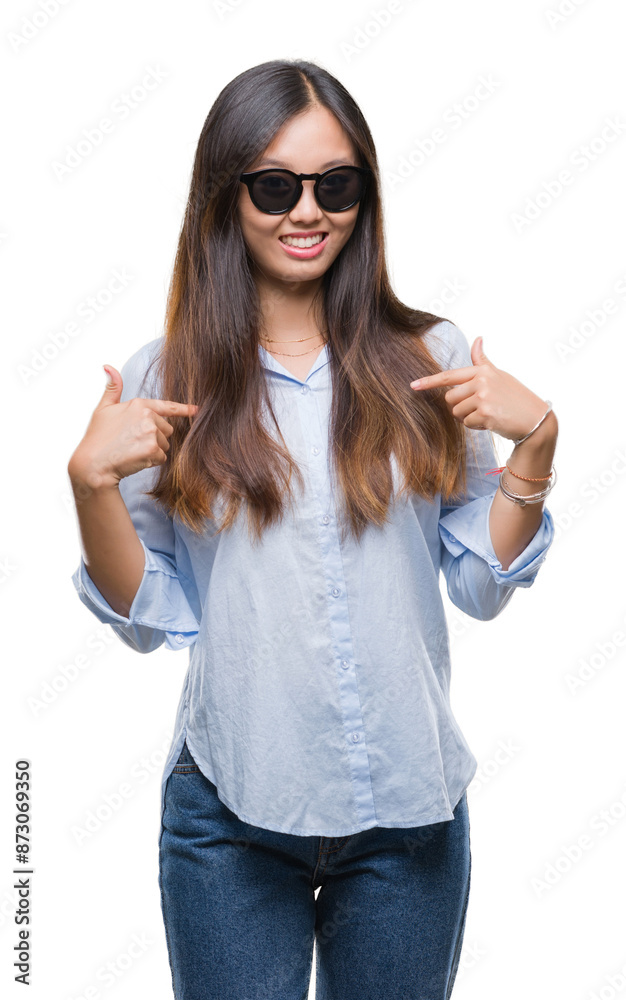 Young asian woman wearing sunglasses over isolated background looking confident with smile on face, pointing oneself with fingers proud and happy. Young asian woman wearing sunglasses over isolated background looking confident with smile on face, pointing oneself with fingers proud and happy.
