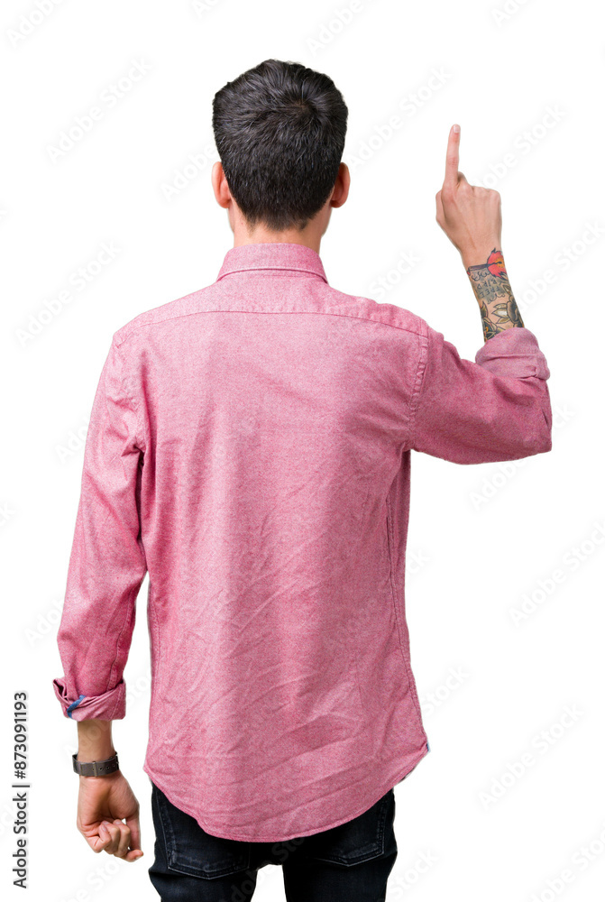 Young handsome man wearing pink shirt over isolated background Posing backwards pointing behind with finger hand Young handsome man wearing pink shirt over isolated background Posing backwards pointing behind with finger hand