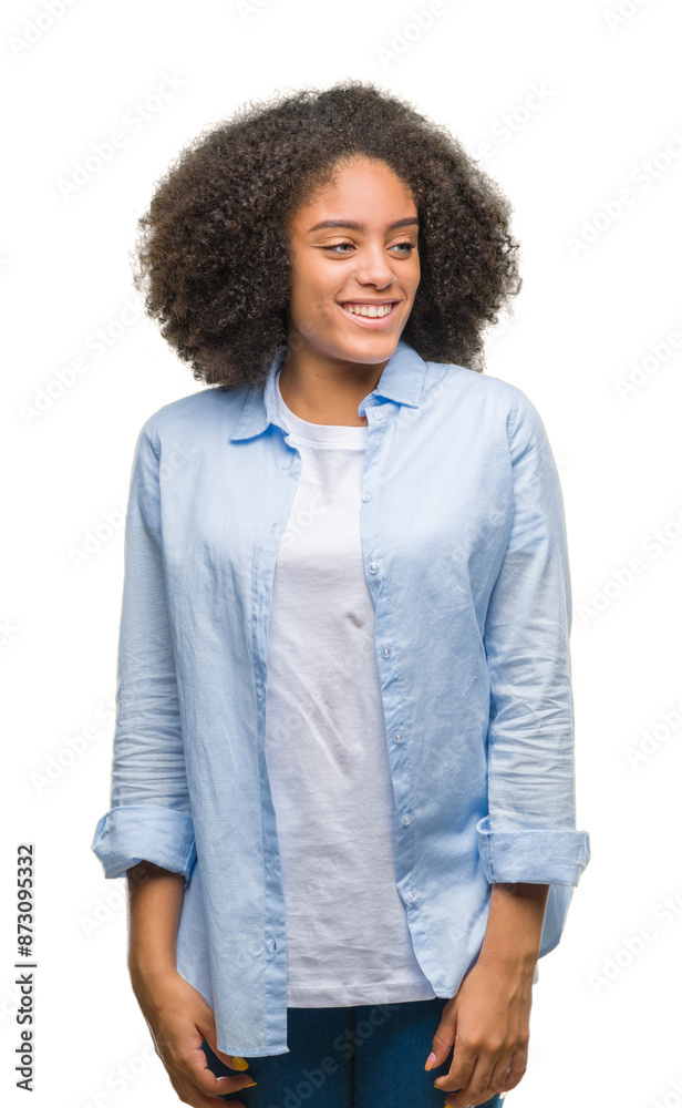 Young afro american woman over isolated background looking away to side with smile on face, natural expression. Laughing confident. Young afro american woman over isolated background looking away to side with smile on face, natural expression. Laughing confident.