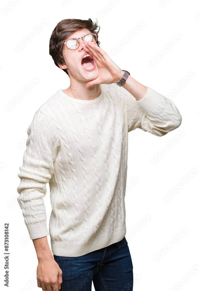 Young handsome man wearing glasses over isolated background shouting and screaming loud to side with hand on mouth. Communication concept. Young handsome man wearing glasses over isolated background shouting and screaming loud to side with hand on mouth. Communication concept.