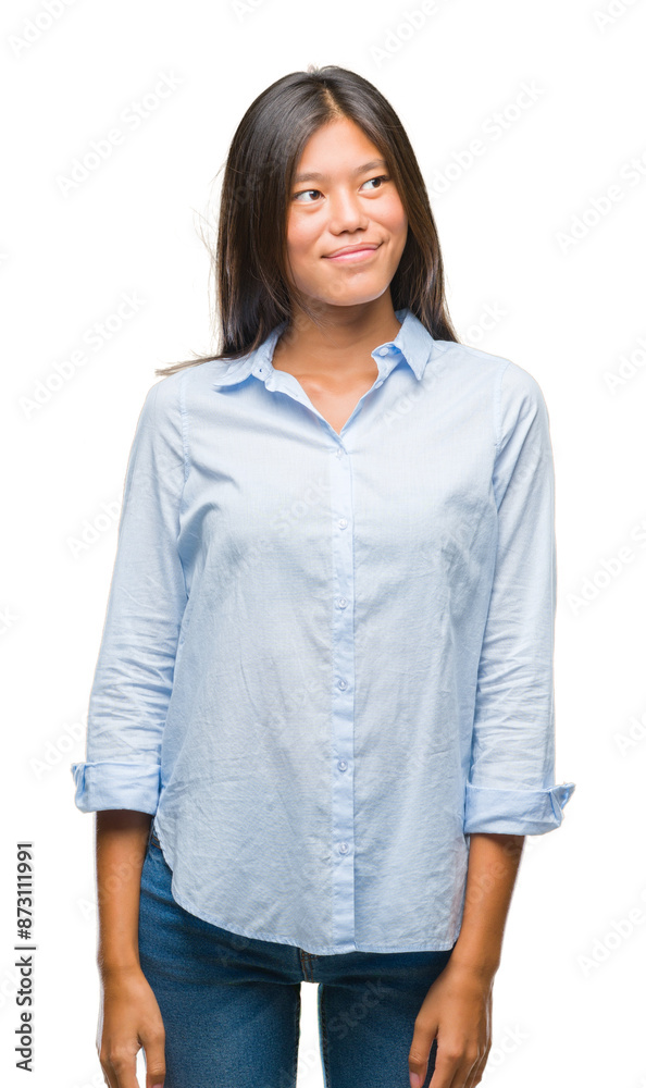 Young asian business woman over isolated background smiling looking side and staring away thinking. Young asian business woman over isolated background smiling looking side and staring away thinking.