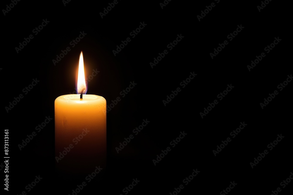 A single lit candle in the dark, symbolizing peace, hope, tranquility, and reflection. Perfect for meditation, spiritual, and serene themes. A single lit candle in the dark, symbolizing peace, hope, tranquility, and reflection. Perfect for meditation, spiritual, and serene themes.