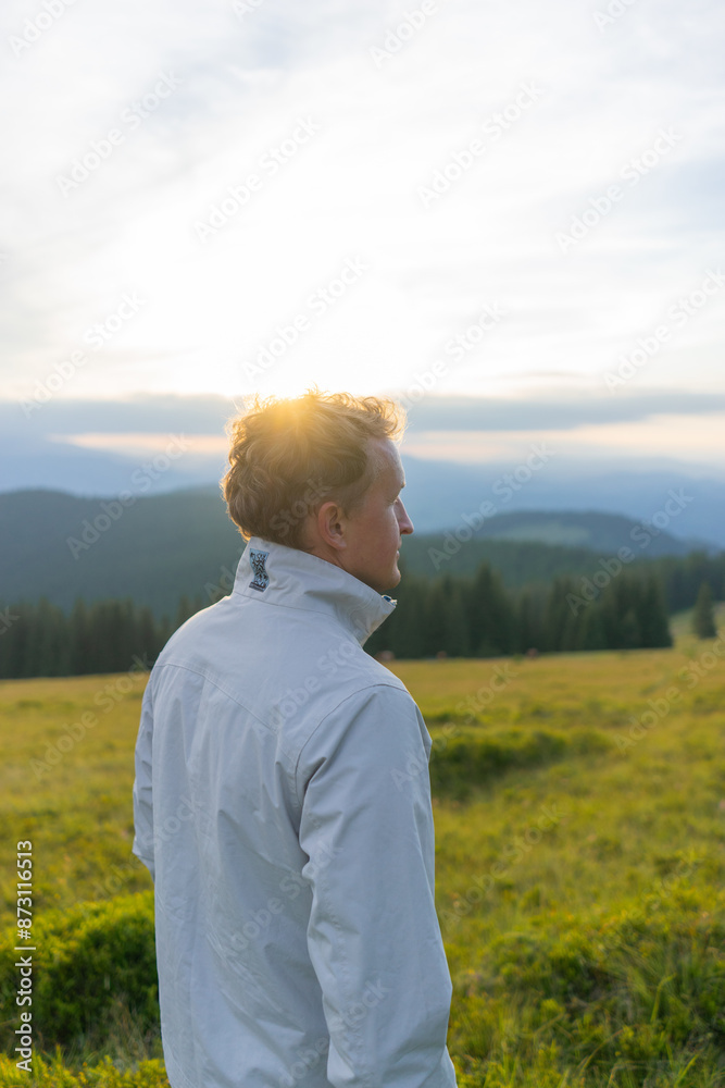 man on a hill overlooking a mountain range, against the background of mountains, tourism, hiking, time together, family, relationships, nature of the Carpathian, vacation, outdoor activities, meditati man on a hill overlooking a mountain range, against the background of mountains, tourism, hiking, time together, family, relationships, nature of the Carpathian, vacation, outdoor activities, meditati